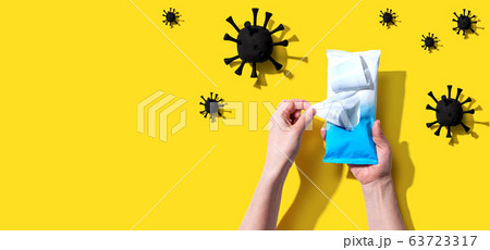 Sanitizer wipe with coronavirus concept Sanitizer wipe with coronavirus concept 63723317