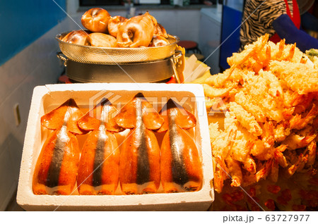 Stuffed Squid (Ojingeo Sundae) and Deep Fried Shrimps (Tempura Shrimps) at Daepo harbor in Sokcho, Korea Stuffed Squid (Ojingeo Sundae) and Deep Fried Shrimps (Tempura Shrimps) at Daepo harbor in Sokcho, Korea 63727977