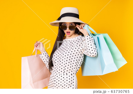 Asian pretty young woman on yellow colour Asian pretty young woman on yellow colour 63730765