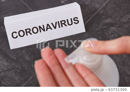 Hands using disinfectant gel with alcohol or soap. 63731300