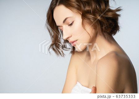 Close up of pleased girl that posing on camera 63735333