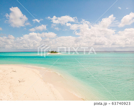 Picture perfect beach and turquoise lagoon on small tropical island on Maldives Picture perfect beach and turquoise lagoon on small tropical island on Maldives 63740923