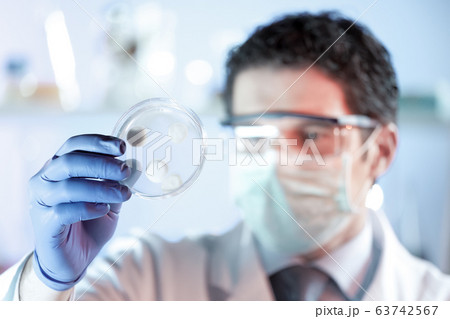 Scientist working in corona virus vaccine development laboratory research facility. 63742567