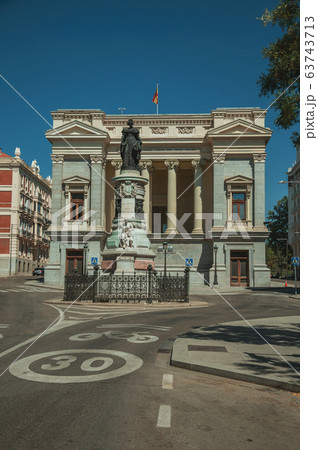 Monument on street in front of building in Madrid Monument on street in front of building in Madrid 63743713