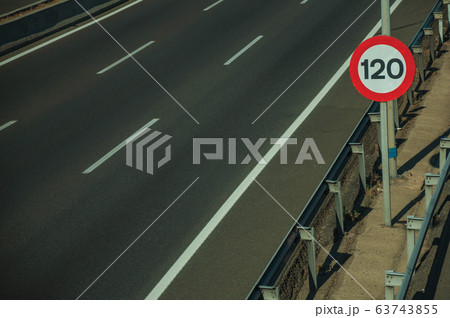 Empty highway with SPEED LIMIT signpost in Madrid 63743855