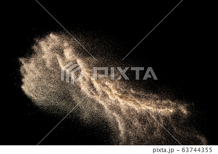 Brown colored sand splash.Dry river sand explosion isolated on black background. Abstract sand cloud. Brown colored sand splash.Dry river sand explosion isolated on black background. Abstract sand cloud. 63744355
