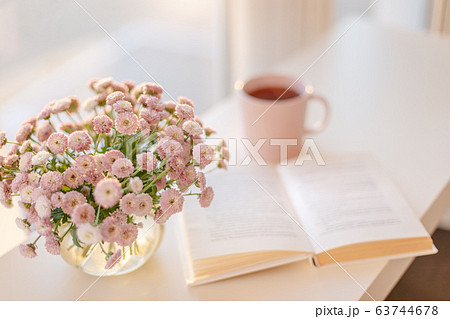 small pink flowers bouquet in glass vase with 63744678