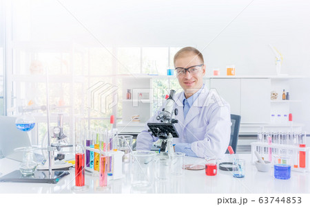 Scientist working or research for some confidential in chemical laboratory 63744853