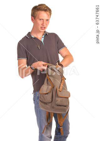 Young shocked student opening his backpack. 63747661