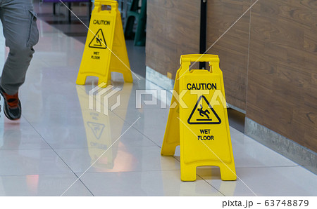 Caution wet floor sign. 63748879