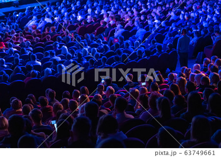 Business conference attendees sit and listen Business conference attendees sit and listen 63749661