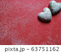Red dusty background with heart shaped biscuits and text space for valentine's day 63751162