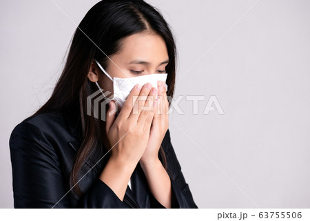 Close up of a businesswoman in a suit wearing 63755506