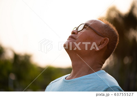 A happy old asian man is relaxing and breathing 63755527