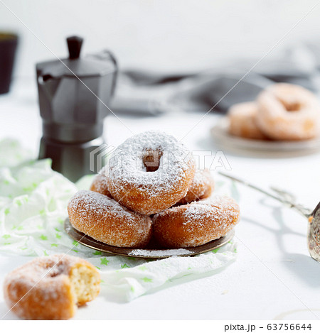 Donuts with sugar powder on the white background 63756644