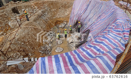 Bore pile cut to level by the construction workers. Next stage is fabricating the pile cap's reinforcement bar and formworks. Bore pile cut to level by the construction workers. Next stage is fabricating the pile cap's reinforcement bar and formworks. 63762616