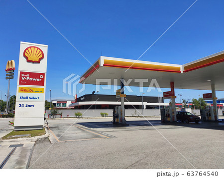 Shell petrol station during daytime. Customers come to visit this petrol station to refuel, buy groceries or use the facilities provided. 63764540