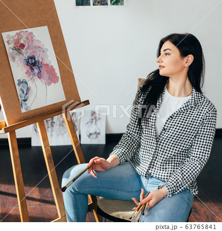 Illustrator or artist at work, doing easel drawing Illustrator or artist at work, doing easel drawing 63765841