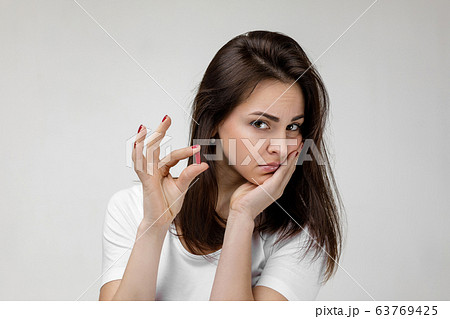 young sad woman suffering from tooth pain young sad woman suffering from tooth pain 63769425