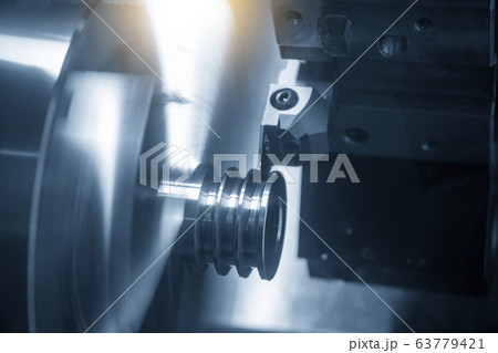 The CNC lathe machine groove cutting. 63779421