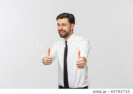 Happy smiling young business man with thumbs up gesture, isolated over white background Happy smiling young business man with thumbs up gesture, isolated over white background 63783710
