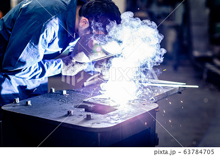 worker welding metal working in steel heavy industry manufacturing. 63784705