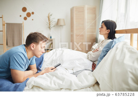 Modern Young Couple Fighting in Bedroom Modern Young Couple Fighting in Bedroom 63785228