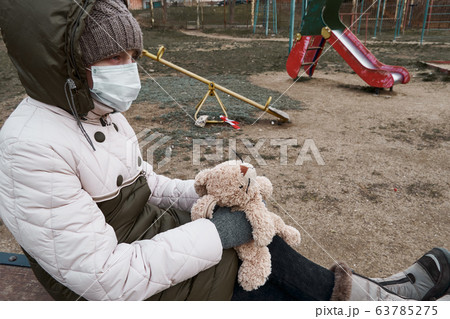 concept of epidemic and quarantine - a girl with a concept of epidemic and quarantine - a girl with a 63785275