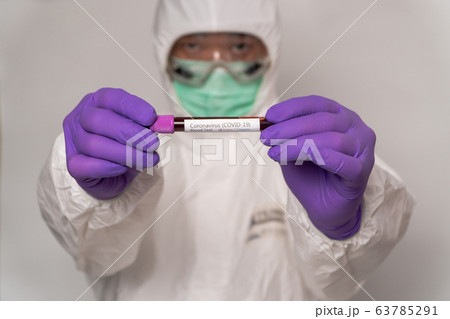 Doctors in the protective suits and masks are 63785291