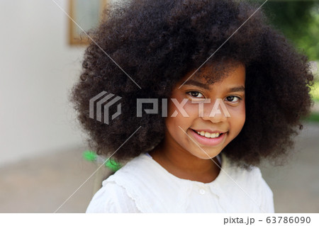 Close up american kid girl smile portrait at home. 63786090