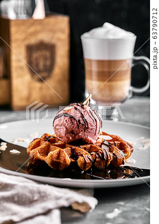 Viennese Waffles with ice cream and coffee. Beautiful picture of dessert with latte coffee. Dessert concept, sweet life. Food photo, copy space, gray background. Viennese Waffles with ice cream and coffee. Beautiful picture of dessert with latte coffee. Dessert concept, sweet life. Food photo, copy space, gray background. 63790712