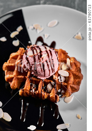 Viennese Waffles with ice cream and coffee. Beautiful picture of dessert with latte coffee. Dessert concept, sweet life. Food photo, copy space, gray background. 63790713