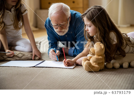 Family of three drawing in sketchbook stock photo 63793179
