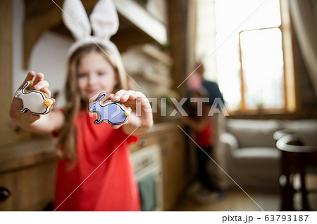 Delicious gingerbreads in hands of girl stock photo 63793187