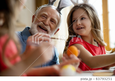 Laughing grandfather with smiling girl stock photo Laughing grandfather with smiling girl stock photo 63793251