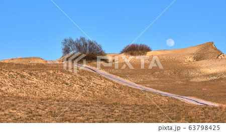View of nordic sand dunes and pathways, Baltic sea at Curonian spit, Nida, Klaipeda, Lithuania 63798425