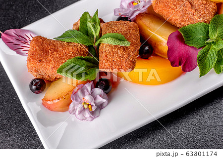 Fresh scented cheese sticks with baked apple Fresh scented cheese sticks with baked apple 63801174
