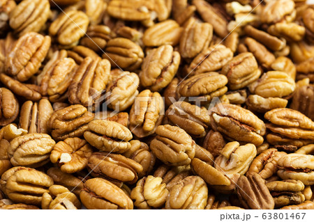 Pecan nuts background. Closeup pekan seeds Pecan nuts background. Closeup pekan seeds 63801467
