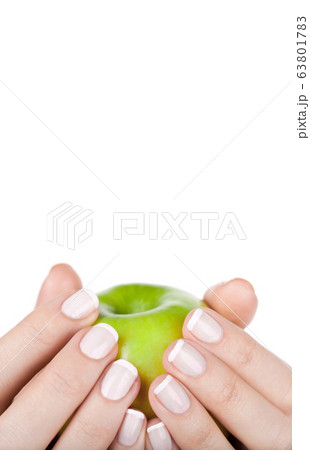 Green apple in hands, closeup. Diet concept 63801783