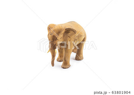 Elephant carved out of hardwood isolated on a white background. 63801904
