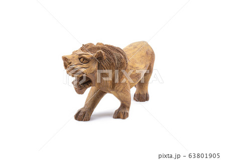 Lion carved out of hardwood isolated on a white background. 63801905