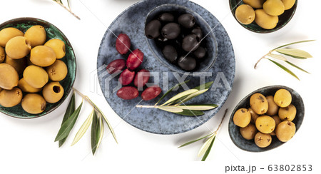 Olives overhead panorama on a white background. Green, black and red olives, shot from above 63802853