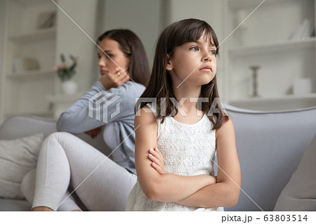 Young mother and small daughter avoid talking after family misunderstanding Young mother and small daughter avoid talking after family misunderstanding 63803514