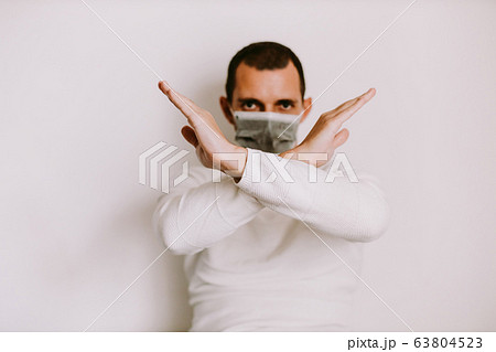 man showing stop sign to virus and diseases 63804523