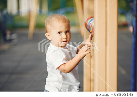Cute little boy have fun on a playground Cute little boy have fun on a playground 63805148