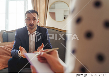 Gesticulating man telling about his psychological problems 63807848