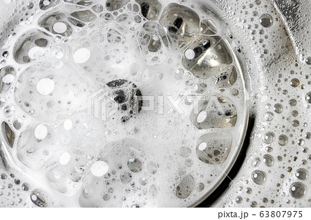 White foam with bubbles of cleaner in a washbasin, White foam with bubbles of cleaner in a washbasin, 63807975