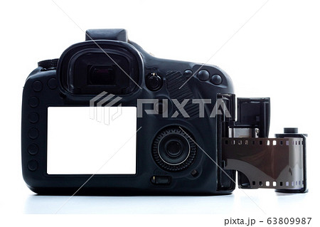 A black digital camera and a film roll on a white background. A black digital camera and a film roll on a white background. 63809987