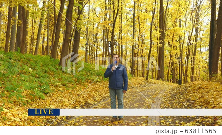 Journalist with microphone 63811565