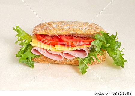 Sandwich with lettuce, ham and tomatoes and Sandwich with lettuce, ham and tomatoes and 63811588